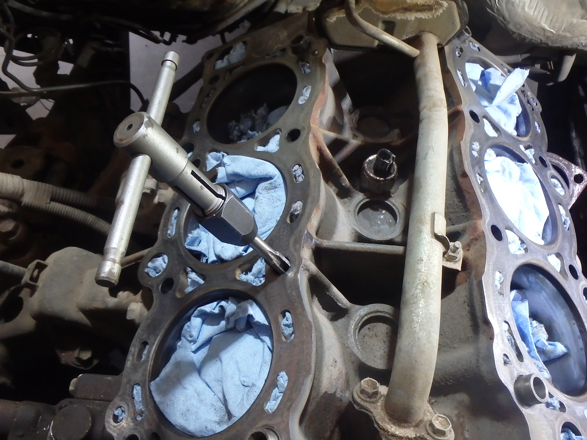 Tapping head bolt holes